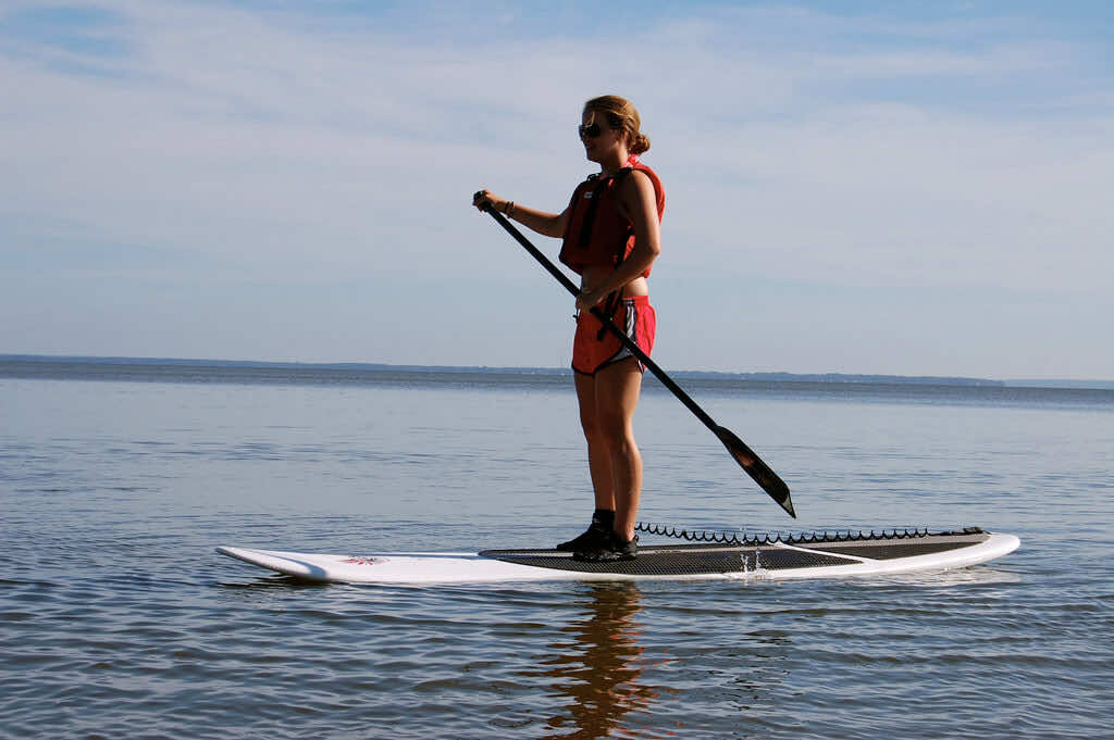 stand up paddleboarding SUP woman